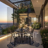 Modern outdoor dining area with a view of the city skyline at sunset.