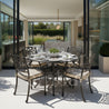 Outdoor dining set with table and chairs on a patio