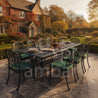Spring döküm aluminyum sandalyeOutdoor dining set with a table and chairs in front of a house with autumn foliage. Pier 18 Cast Aluminum dining table.